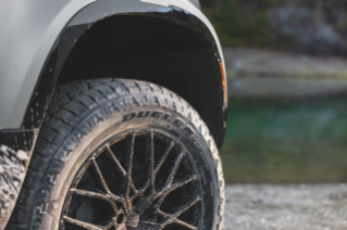 Dueler A/T Ascent pictured on a river bank.